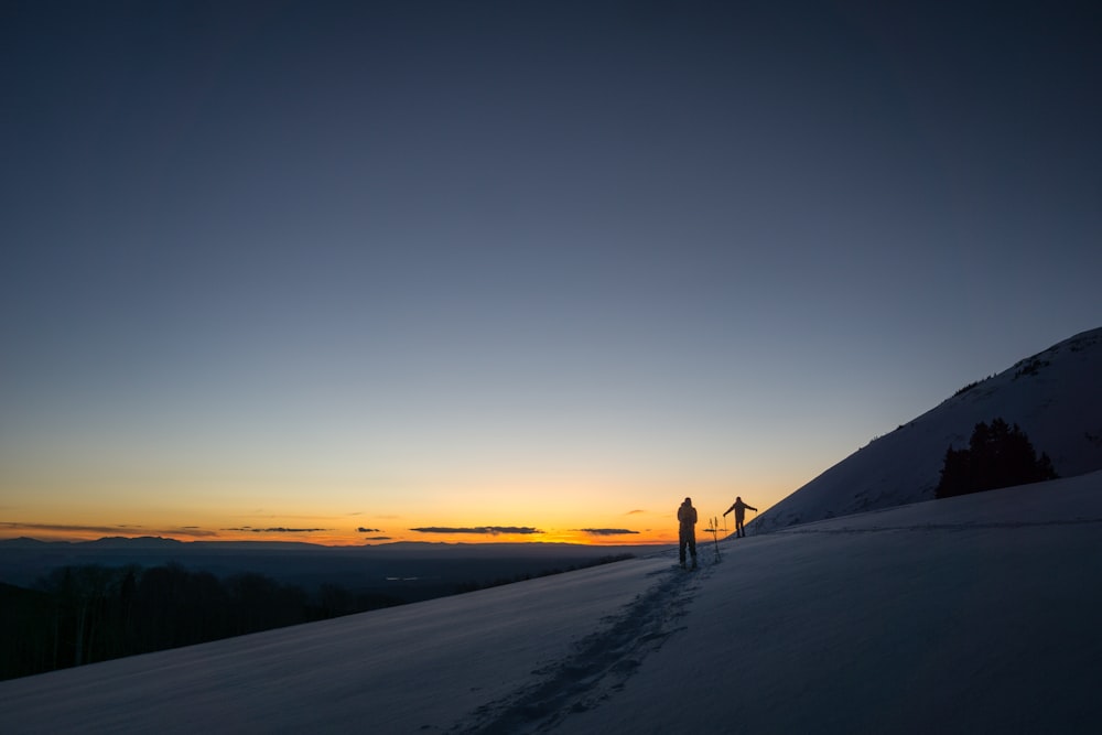 person standing on snowfield during daytime