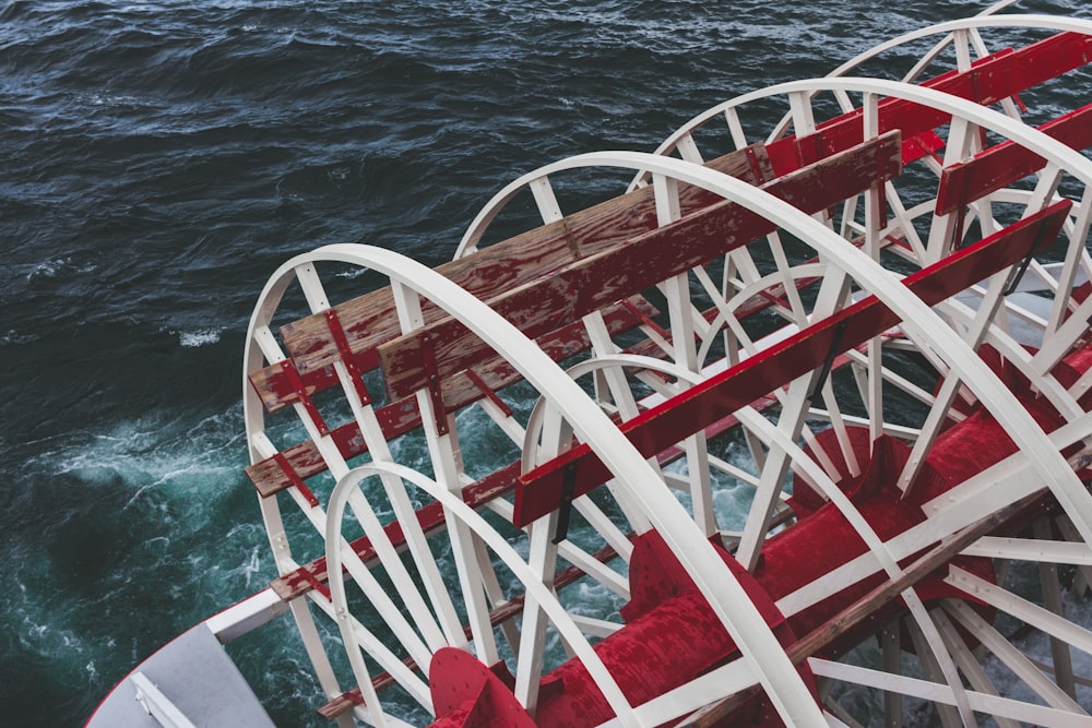 red and white ship on sea during daytime