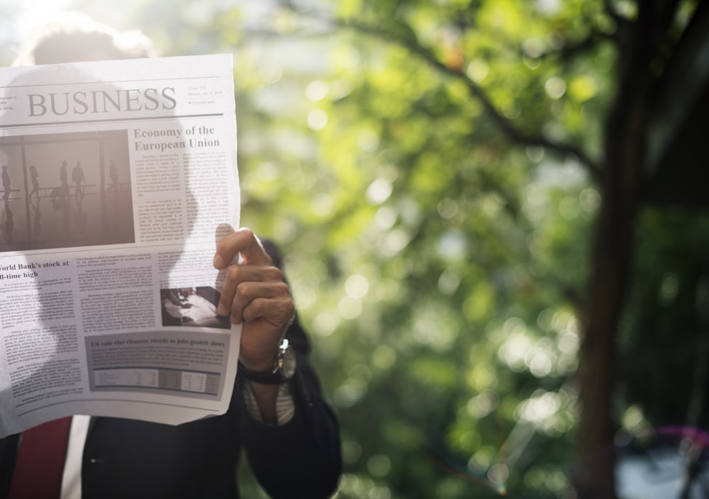 man reading newspaper