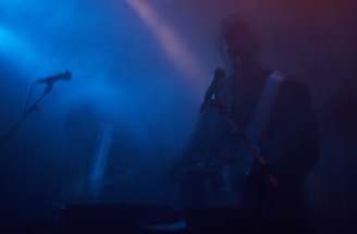 A lively scene of Willy Blues performing on a vintage guitar in a smoky blues club.