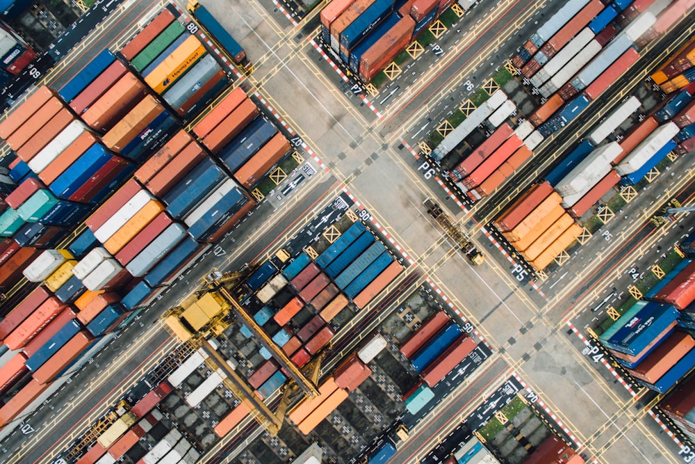 A drone shot of colorful shipping containers in a shipping terminal