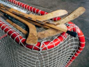 A close-up of hockey sticks crossed over a puck on the rink