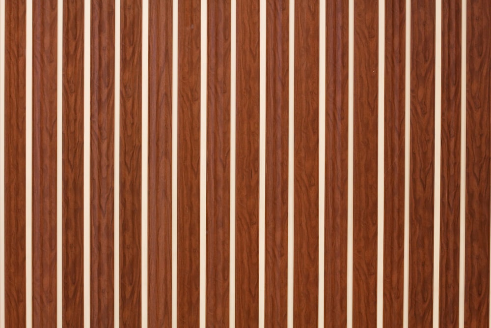 a close up of a wooden door with vertical stripes
