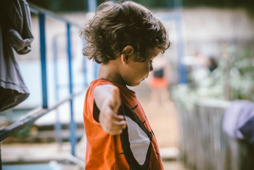 kid wearing deadpool shirt