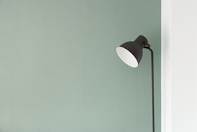black floor lamp at the corner