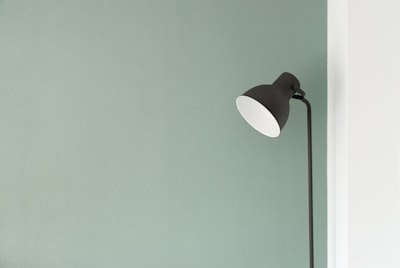 black floor lamp at the corner simple teams background