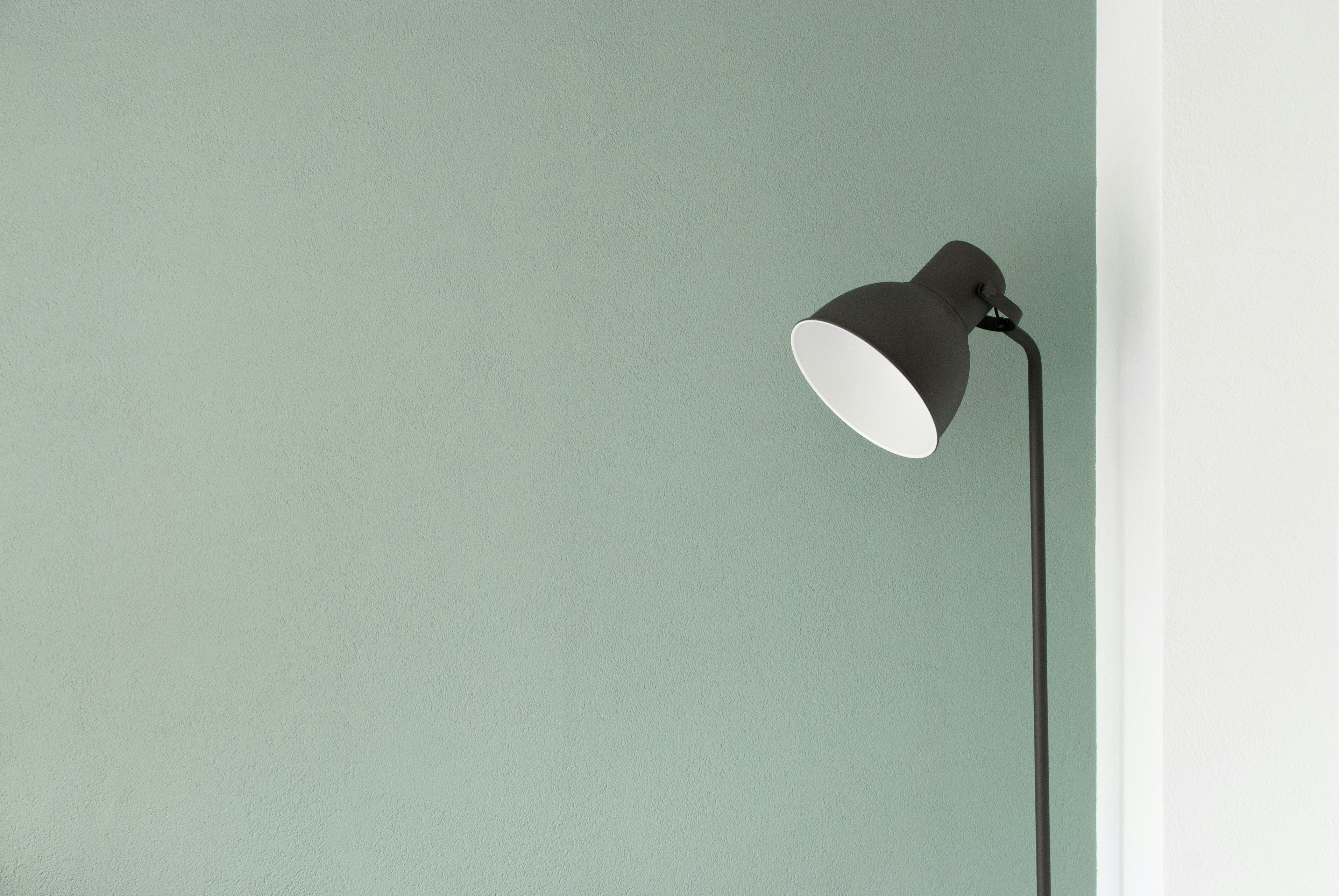 Floor lamp near a wall