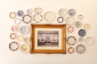 photo frame near assorted-color ceramic dishes