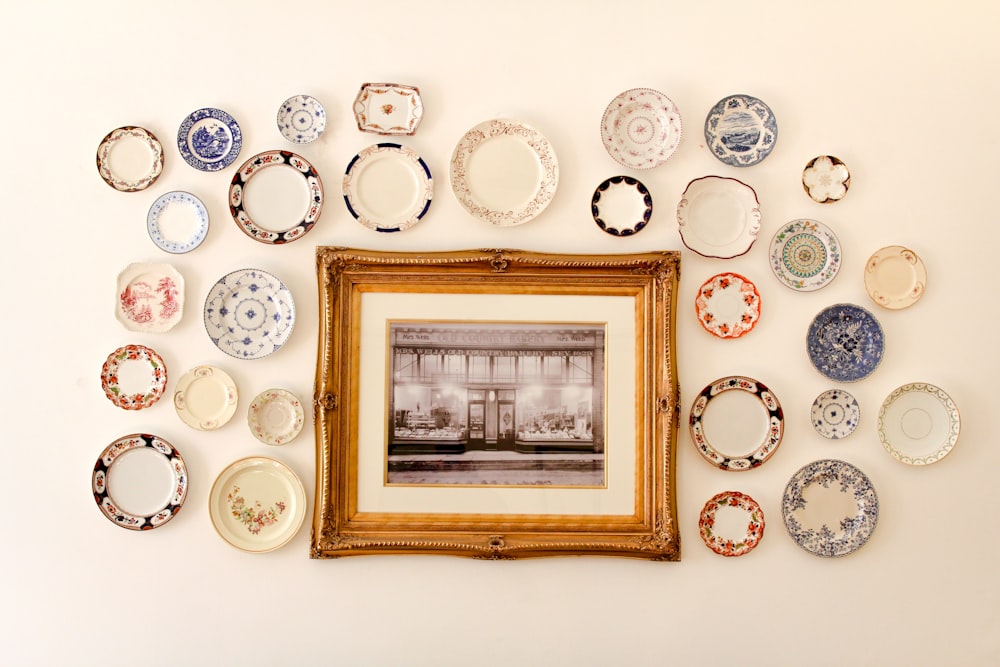 photo frame near assorted-color ceramic dishes