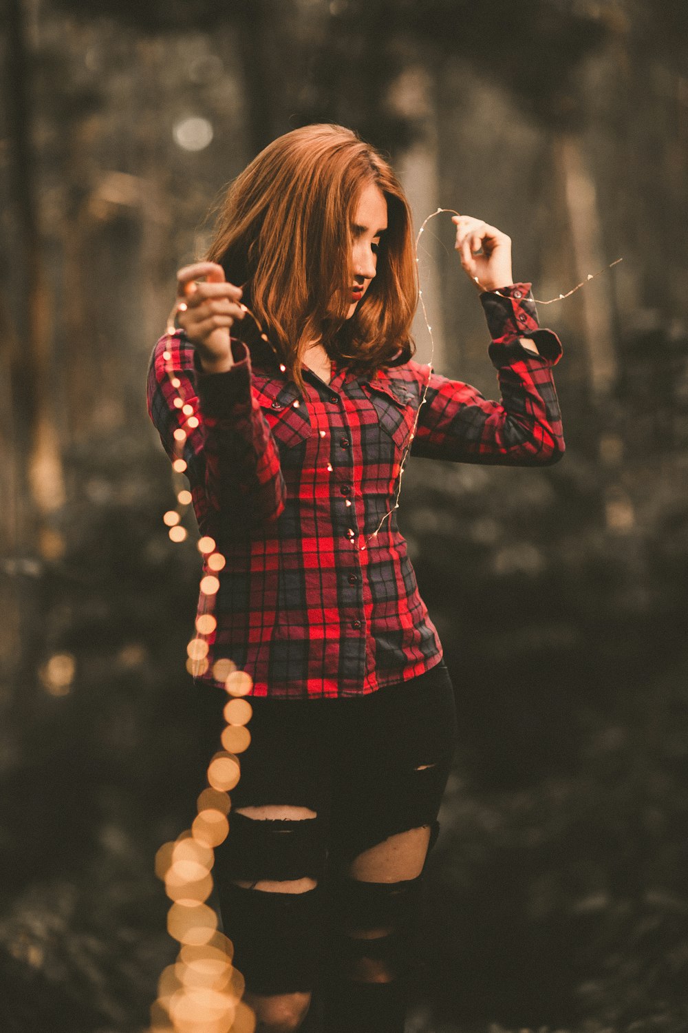 woman in red and black dress shirt