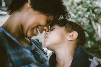 selective focus photography of woman and boy