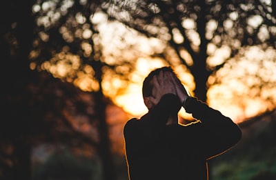 man wearing black long-sleeved shirt sadness google meet background