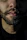 Close-up of a well-groomed beard styled perfectly under warm salon lighting.