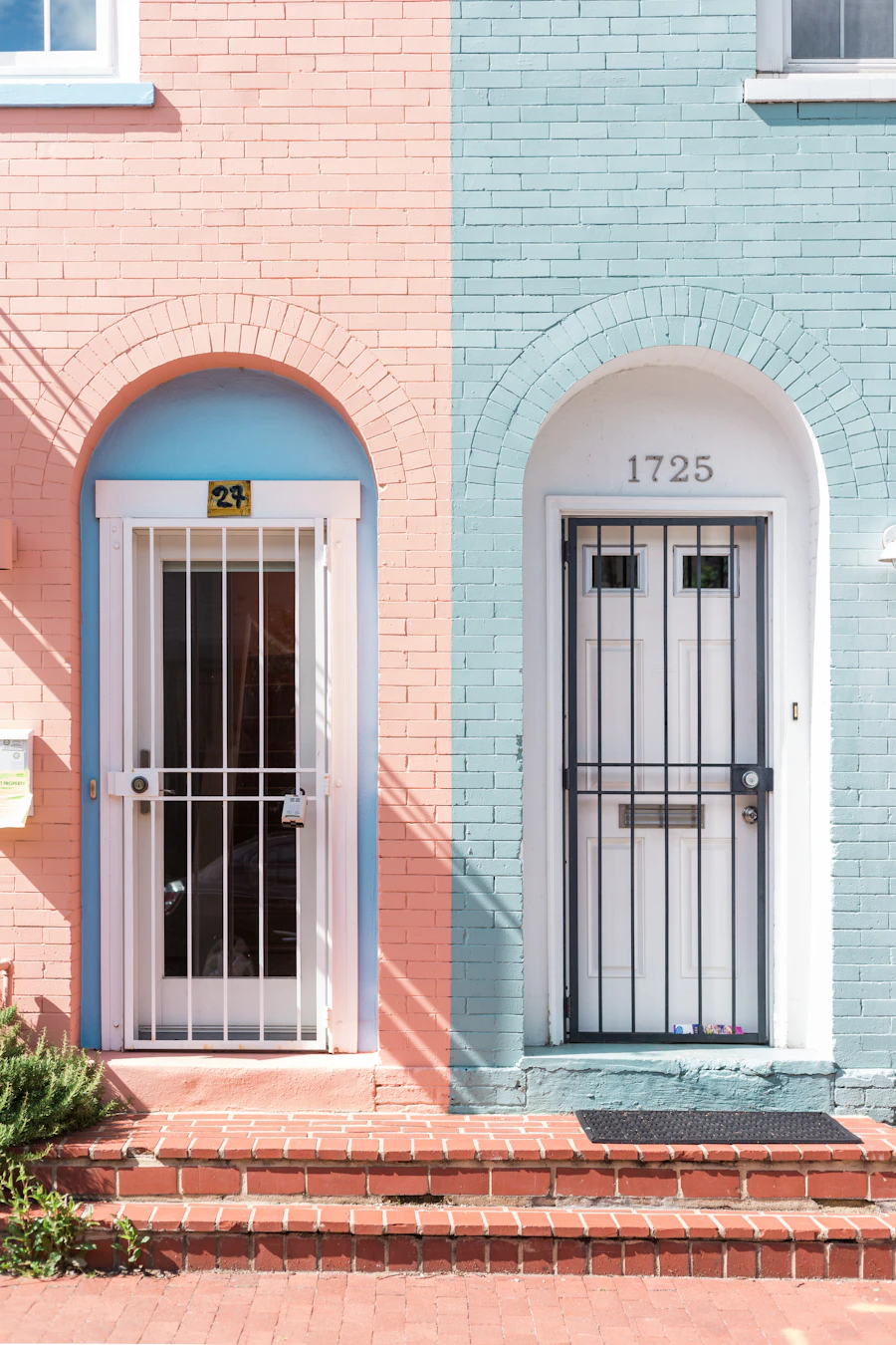 Two separate white doors side by side