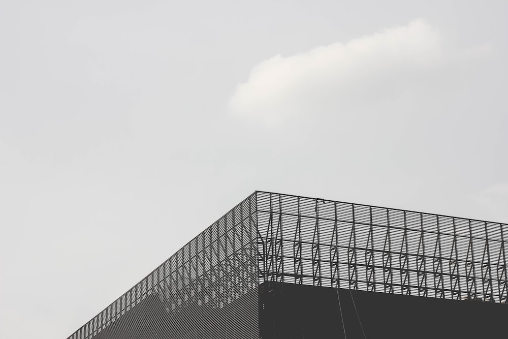 grayscale photo of curtainwall building