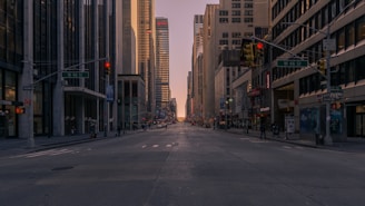 gray concrete road between buildings