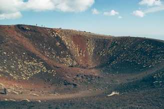 Tourists hiking the sandy paths around Bromo crater