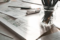 A serene workspace with sketches and notes mapping out symbolic structures.