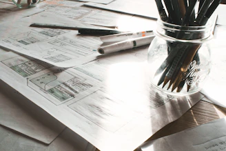 Workshop materials spread out on a table with notes and colorful markers.