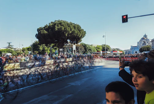 A vibrant street scene from Columbia's Iron Kid event, showing kids racing with smiles and energy.