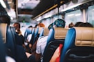 selective focus photography of people on bus
