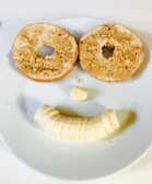 A playful peanut butter character made of food with googly eyes on a plate.