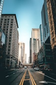 photography of road besides buildings during daytime