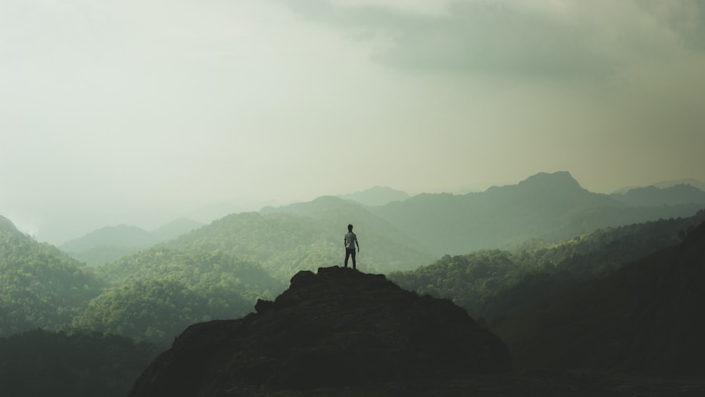 person standing on mountain