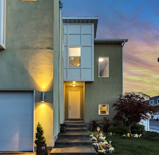 exterior of home at dusk with lights on in Arizona powered by solar