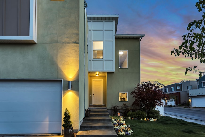 An image of a house with outdoor lighting