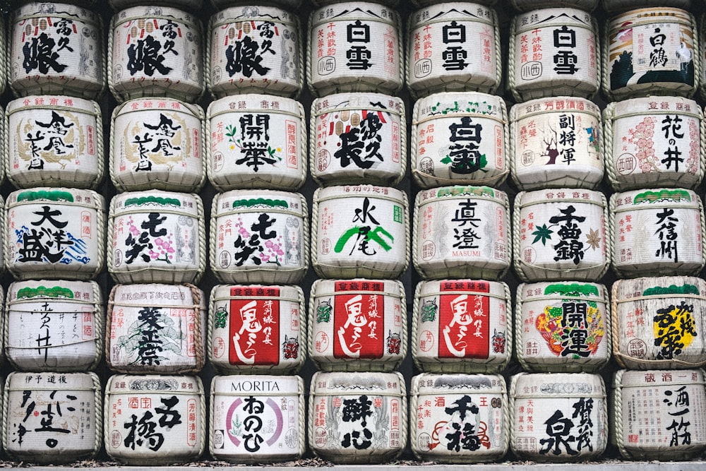 assorted white jar with kanji texts