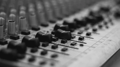 Minimalist shot of a soundboard with cream and beige tones, emphasizing tactile controls.
