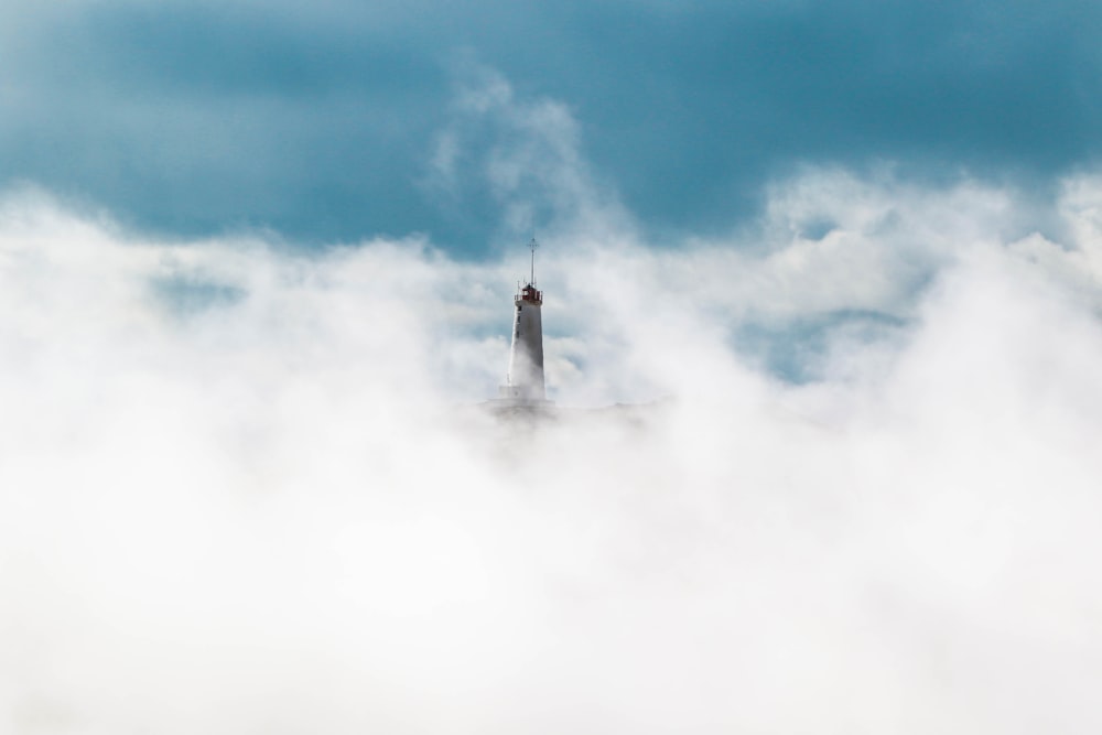 gray statue covered in white clouds