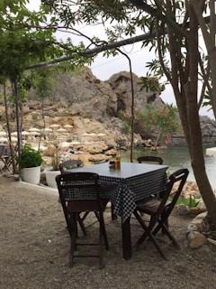 A serene outdoor dining setup with food and drinks.