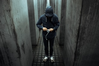 photo of person wearing black pullover hoodie