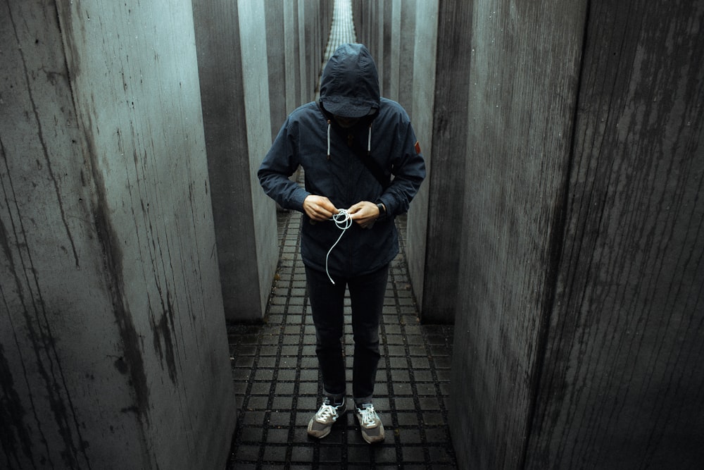 photo of person wearing black pullover hoodie