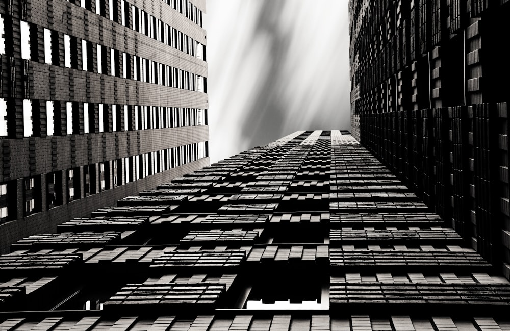 low-angle photo of gray concrete high-rise building