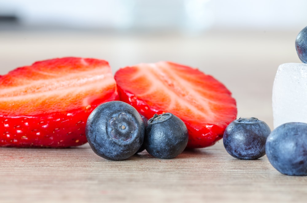 selective focus photography of strawberry and blueberries