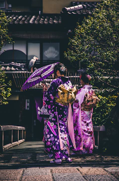 two women in purple and pink kimono