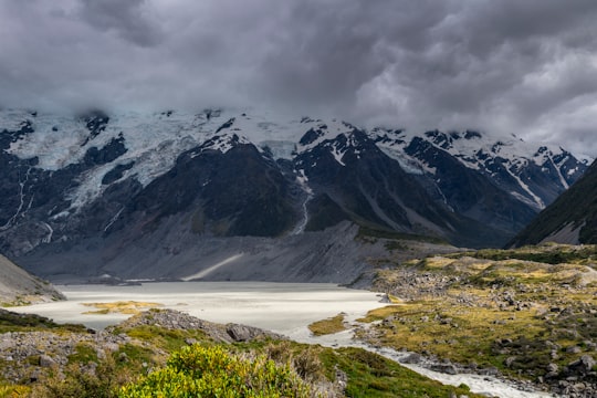 landscape photography of mountain under cloudy sky during daytime in Aoraki/Mount Cook National Park New Zealand
