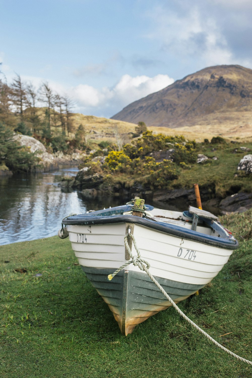 white boat near bodies of water