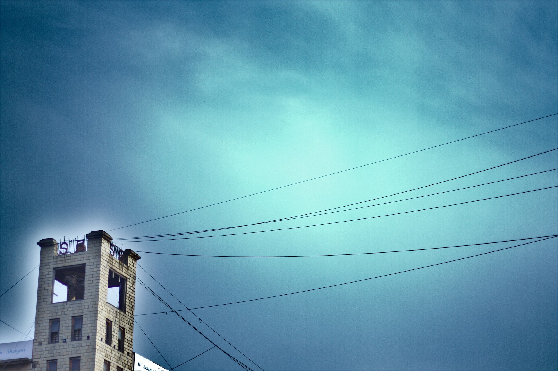 woman wearing yellow long-sleeved dress under white clouds and blue sky during daytime