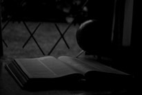 An open book with a globe in the background, symbolizing global publishing.