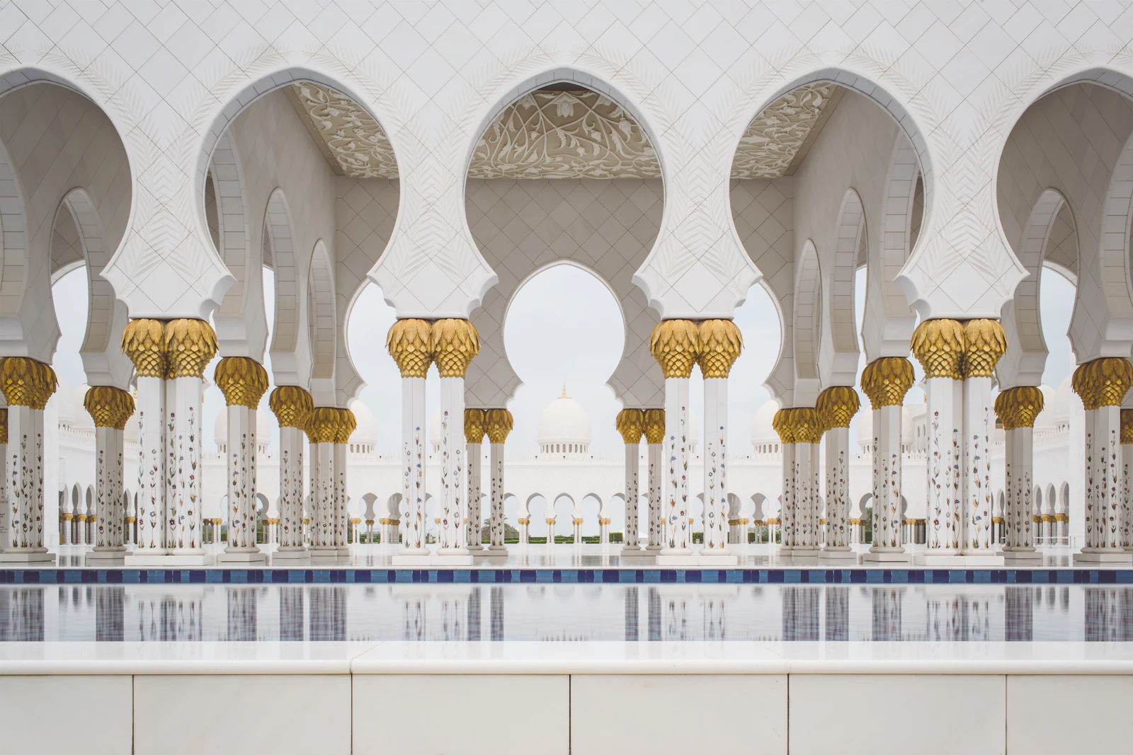 White columns and reflecting pool at Sheikh Zayed Grand Mosque