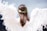 woman wearing white angel wings