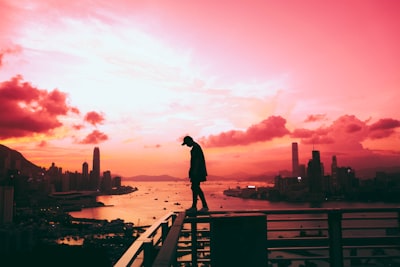 silhouette of person standing on railing tumblr google meet background