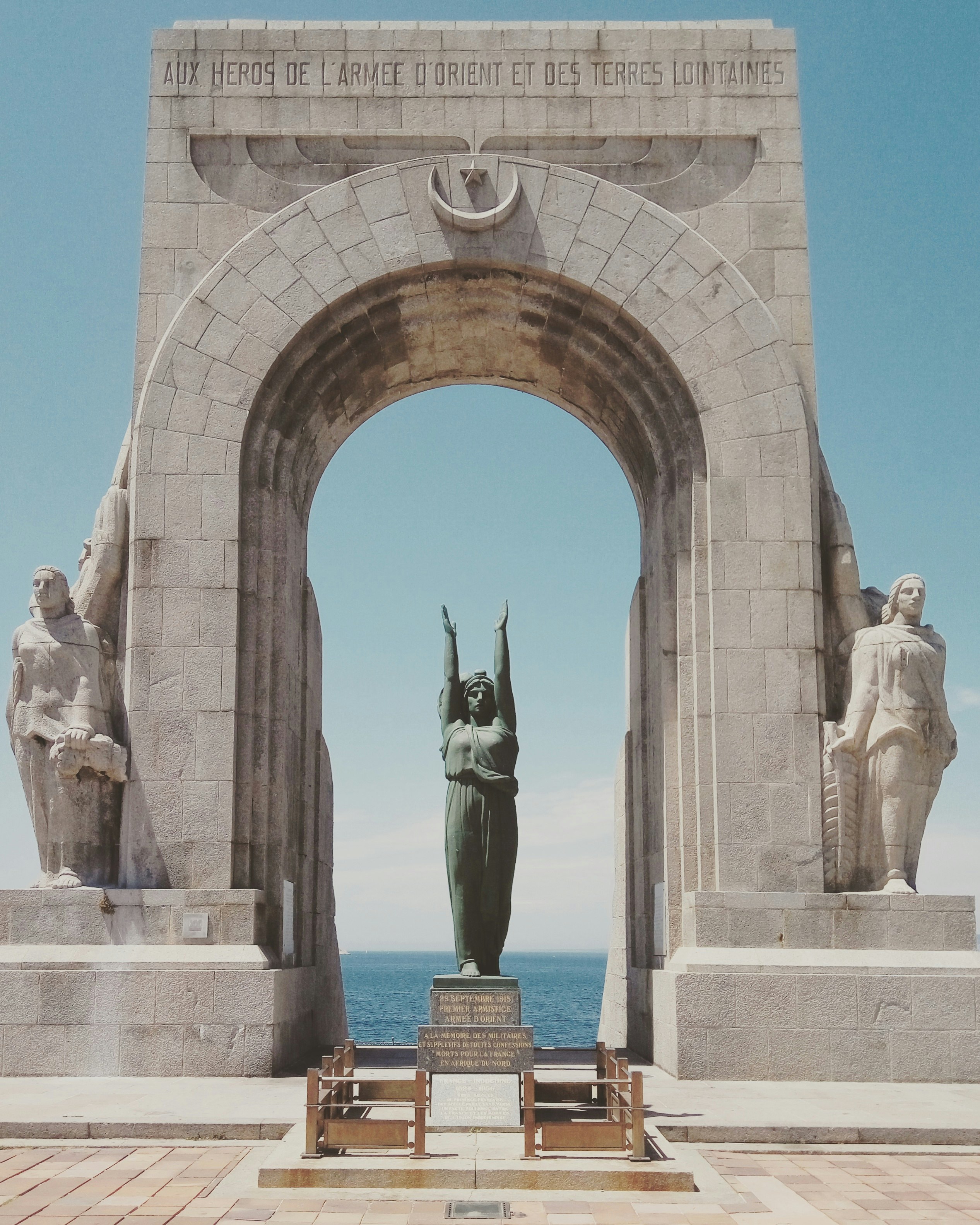 The Porte d’Orient, or The Oriental Door) - represents the thousands of French-African Colonial soldiers who left from the shores of Marseille to fight in the the Orient during World War I. 

This marked an important and significant moment in my journey through and across Europe on my bike. I had just cycled the length of France, and subsequently collapsed in an exhausted heap infront of the arch after I took this photo.