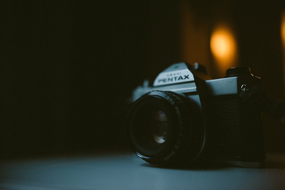 silver Pentax DSLR camera