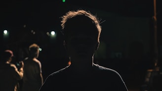 a man standing in the dark at night
