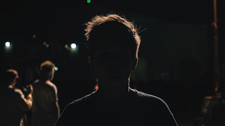 a man standing in the dark at night